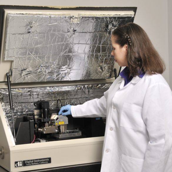 Scientist performing surface analysis and materials testing