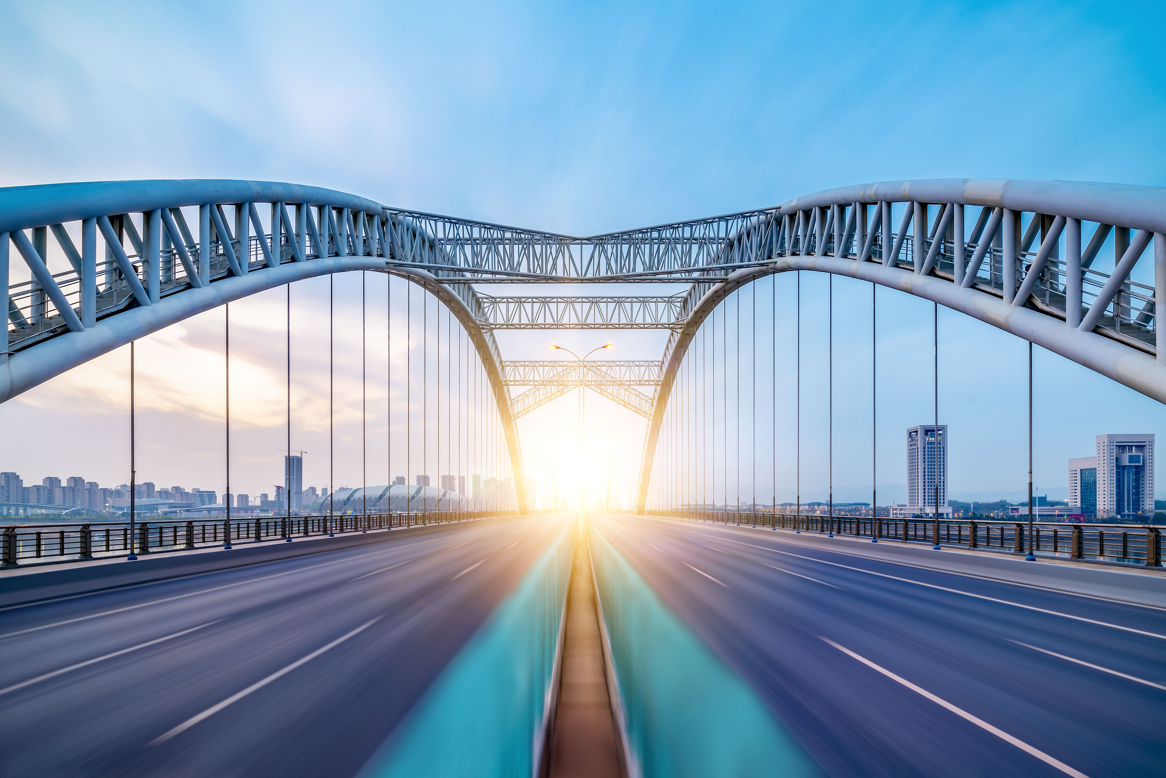Close up of bridge overlooking sunset