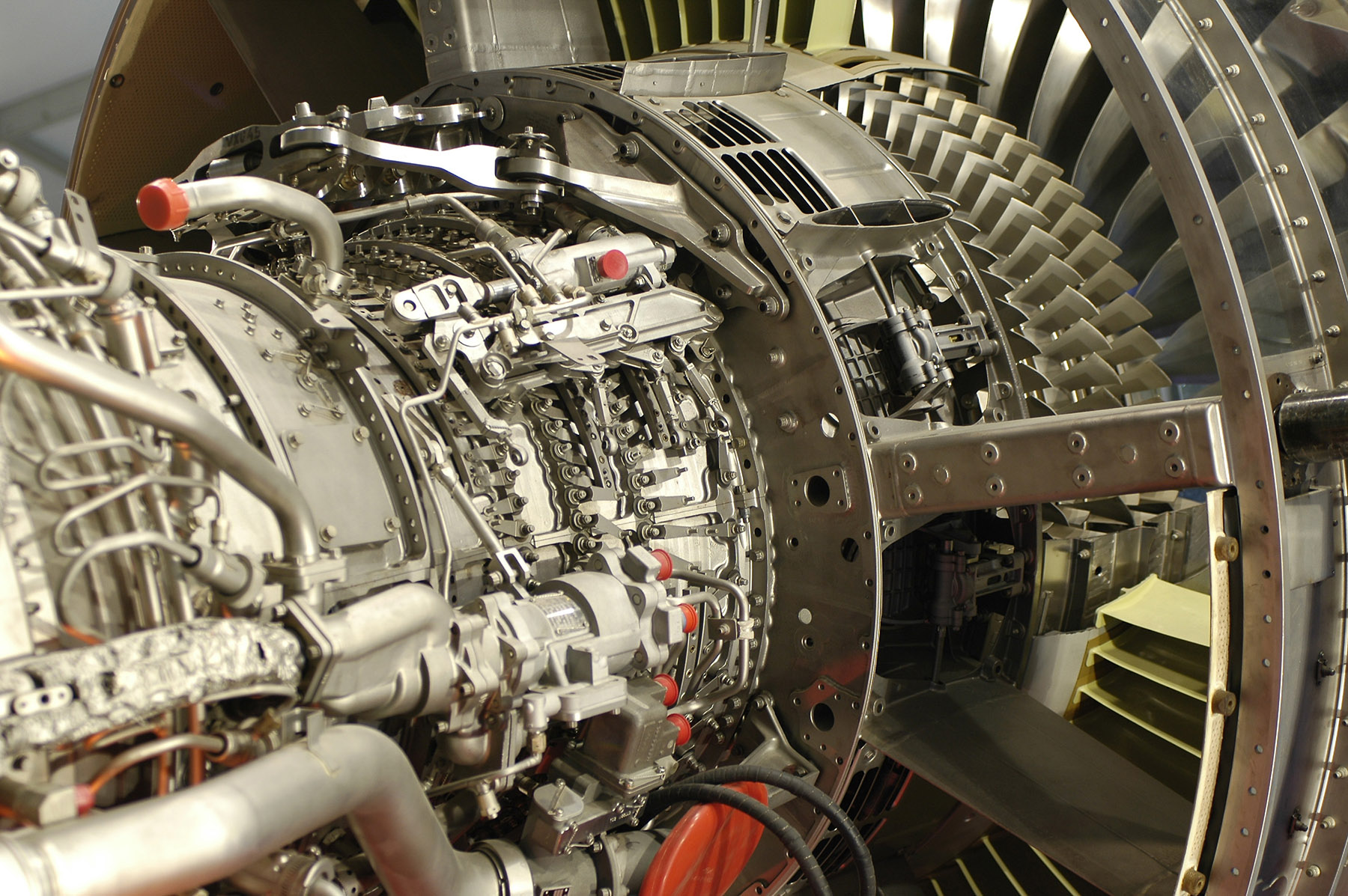 Close-up of a modern jet engine showing intricate mechanical components