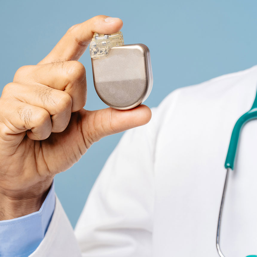 Doctor holding pacemaker